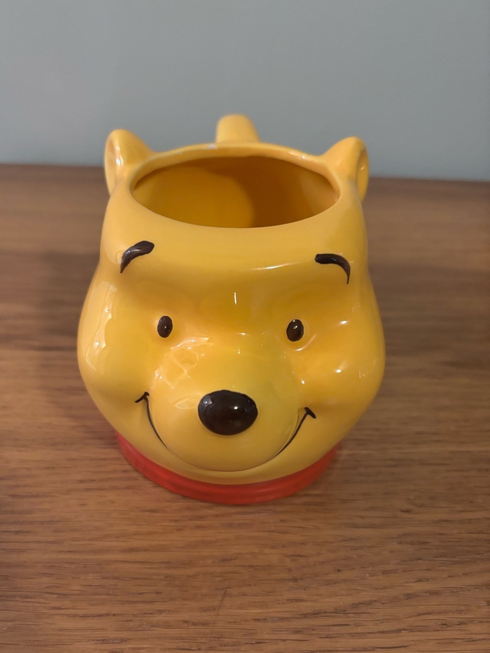 Disney Winnie the Pooh ceramic mug features a 3D sculpted face design